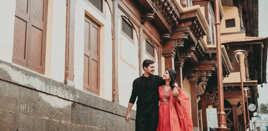 Couple walking through an old Indore street, a documentary wedding photography moment