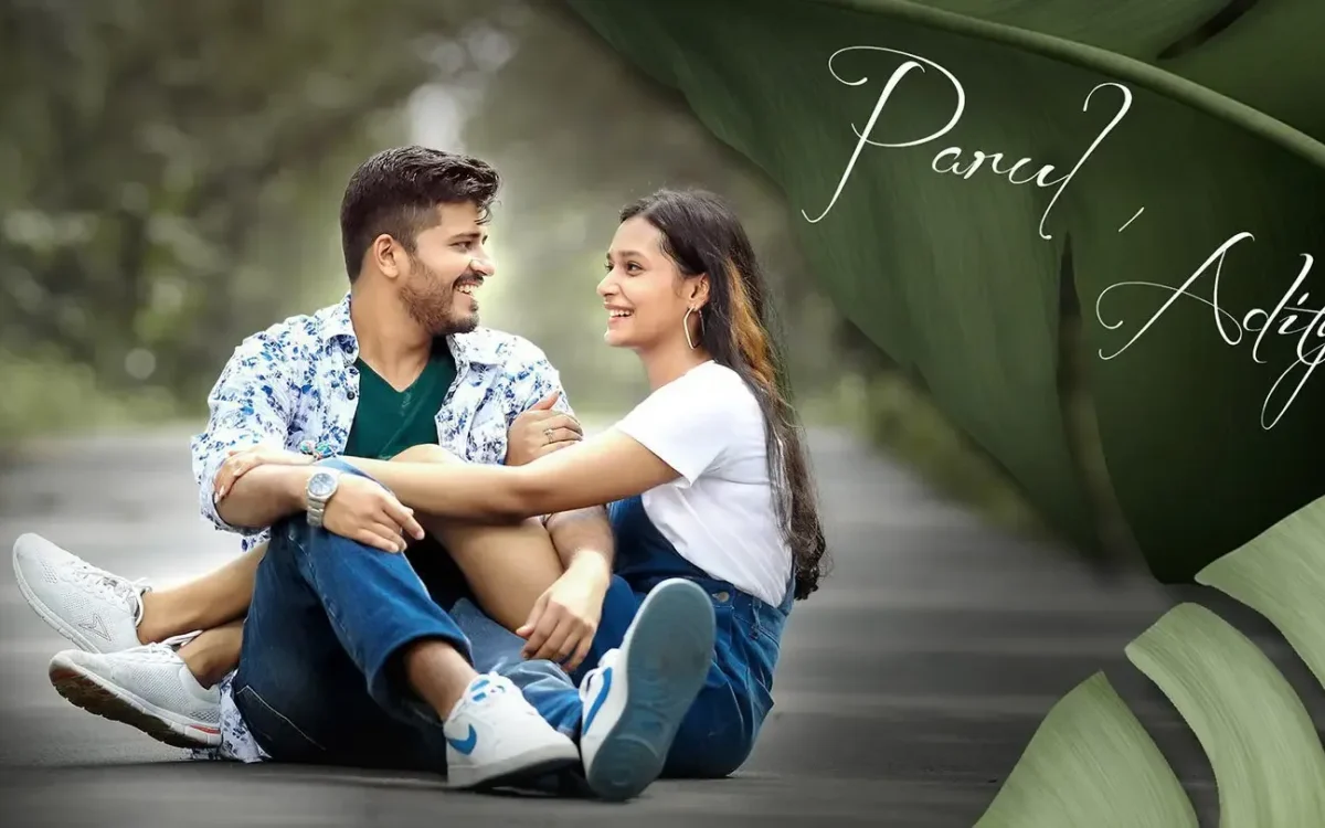 Couple sitting casually together on a pathway for a relaxed pre-wedding shoot