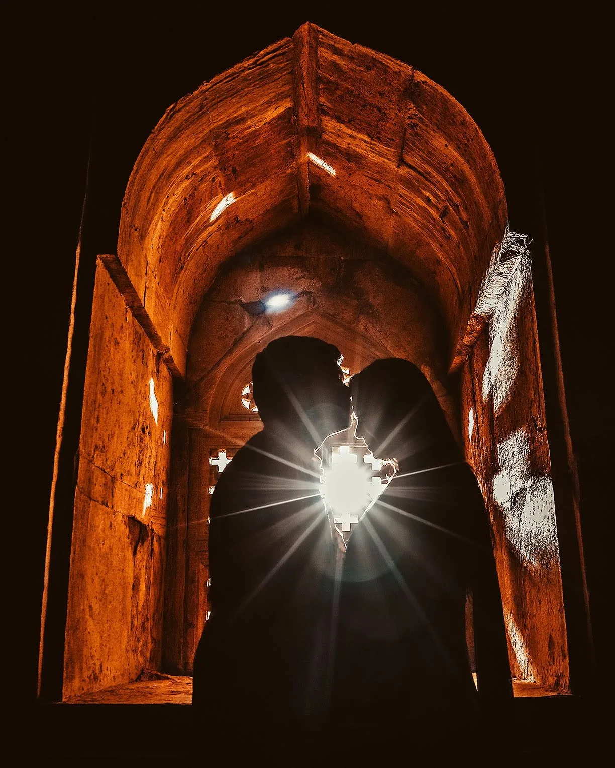 Couple silhouette under a heritage archway at sunset, pre-wedding shoot near Indore