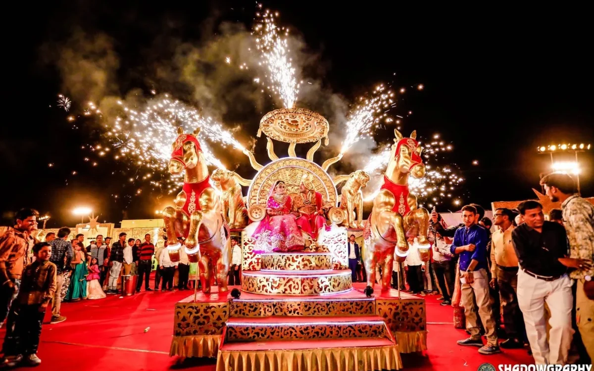 Wedding baraat celebration with fireworks sparklers and a decorated stage, wedding photography in Indore