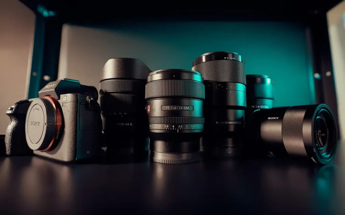 Professional camera bodies and prime lenses lined up on a table, wedding photographer gear